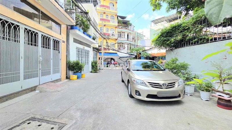 Bán nhà sát hẻm xe hơi và gần mặt tiền lê quang định, 4 tầng